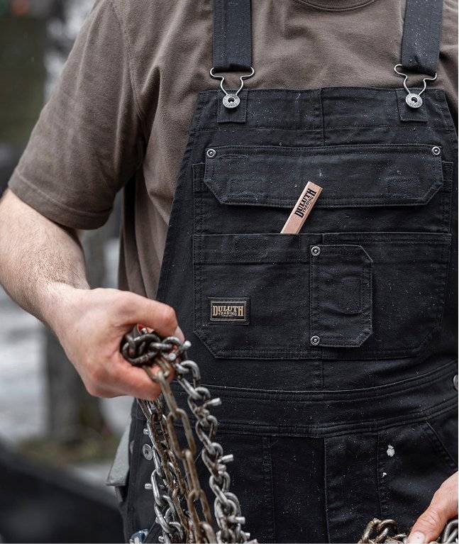 Man wearing black overalls