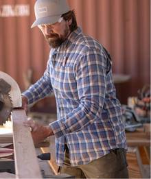 Man wearing a flannel shirt.