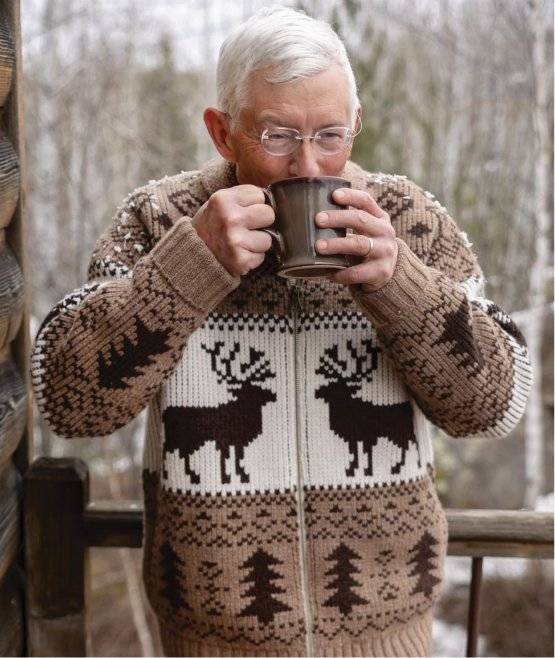 Man wearing sweater with reindeer pattern
