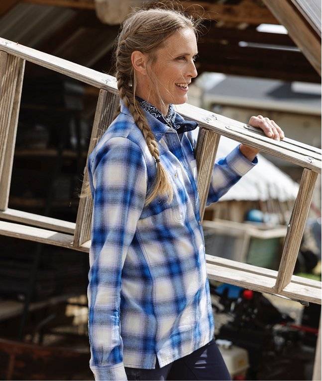 Woman wearing a blue flannel