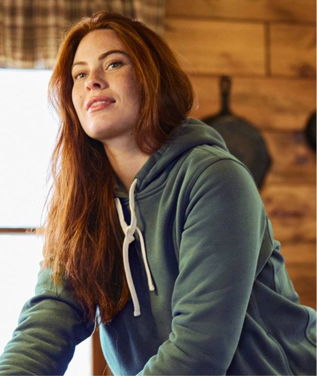 Woman wearing a green hoodie