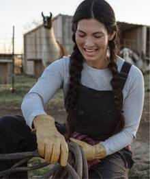 Woman wearing black overalls