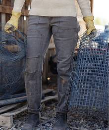 Woman wearing grey work pants.