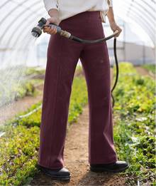 Woman wearing brown stretchy pants.