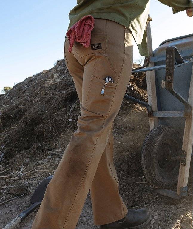 Woman wearing brown work pants.