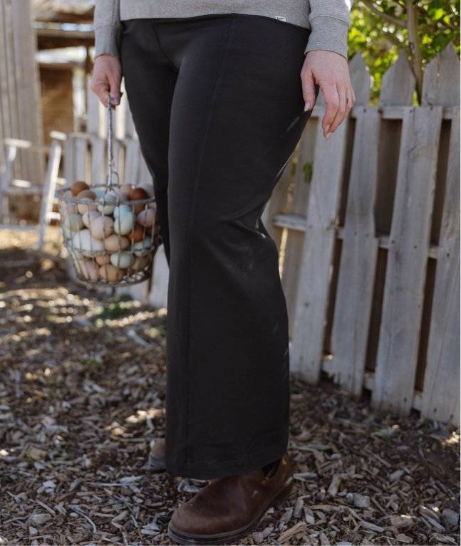 Woman wearing black pants.