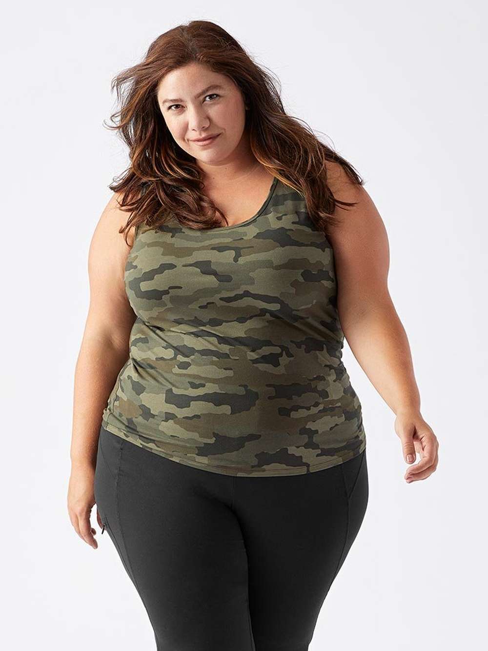 Woman in camo tank top with black leggings