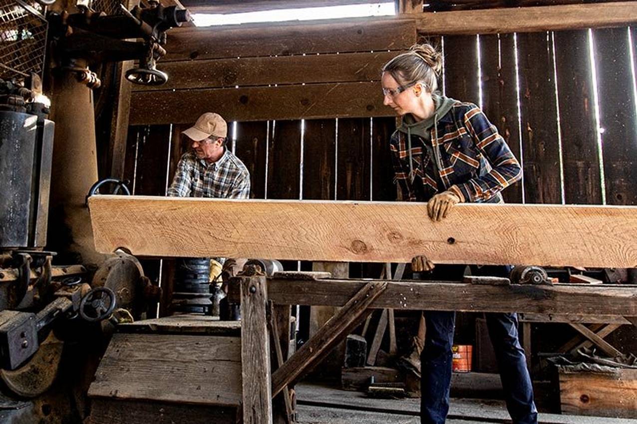 gregg and sarah operating a steam-powered sawmill