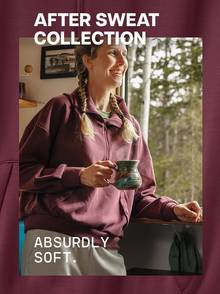 Woman drinking coffee in maroon half zip top.