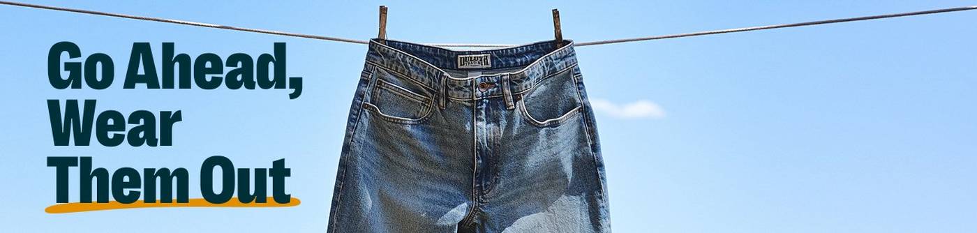 Jeans hanging on a clothes line. Headline: go ahead, wear them out.