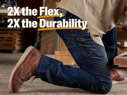 Man crouching in jeans.