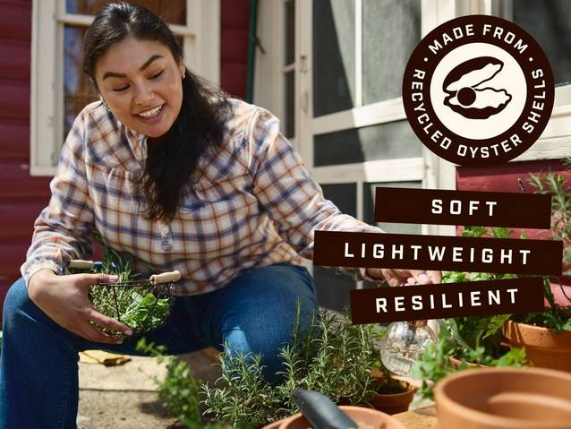 Woman wearing flannel made from recycled oyster shells.