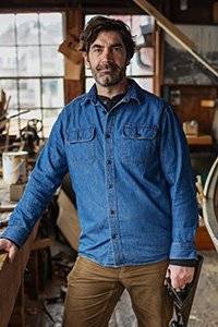 man in a long sleeved denim button down shirt