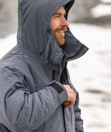 Man wearing grey coat.