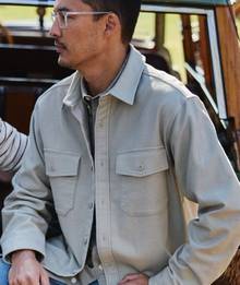 Man wearing tan button down.
