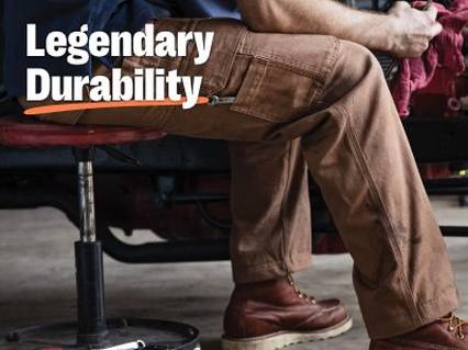 Man sitting in chair wearing Fire Hose® pants.
