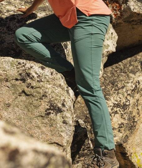 Woman hiking in green pants.
