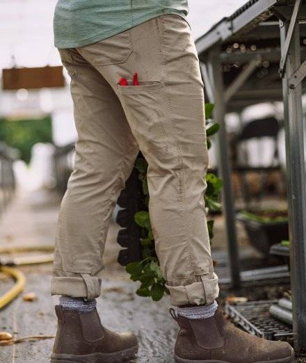 Woman wearing khaki work pants.