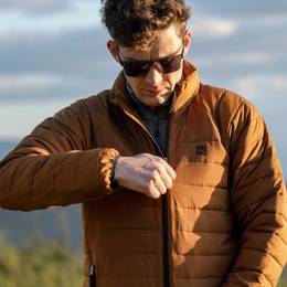 Man zipping up an orange jacket.