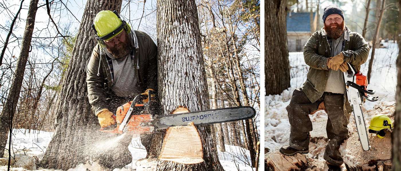 Taylor uses a chainsaw to cut down trees in the snowy woods
