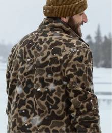 Man wearing a camouflage fleece jacket
