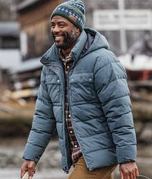 A man in a puffy blue coat