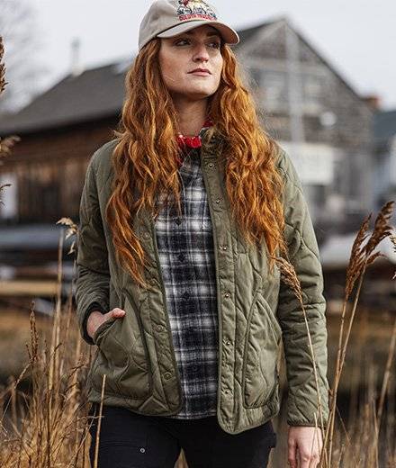 A woman in a green coat