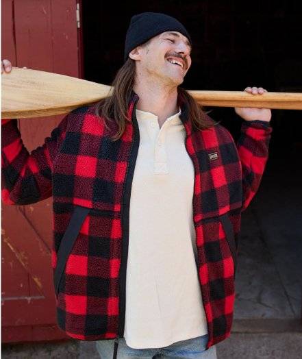 Man wearing a black and red plaid fleece jacket.