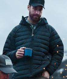 Man wearing a black puffer jacket.