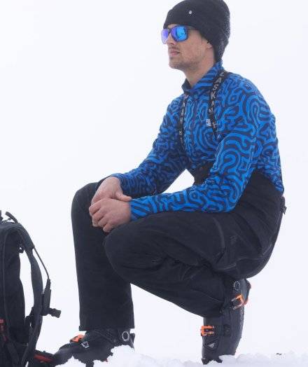 Man wearing black pants with suspenders.