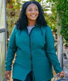 Woman wearing a blue shell jacket.