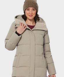 Woman wearing a tan insulated coat.