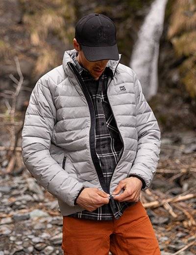 Man wearing a grey puffer jacket.