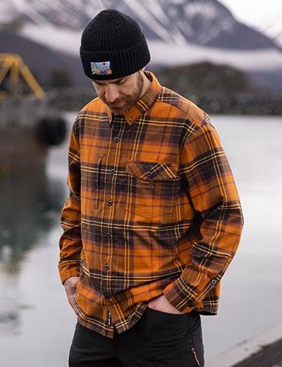 Man wearing an orange flannel.