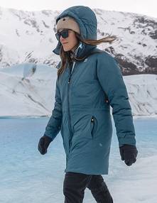 Woman wearing a blue hooded jacket.