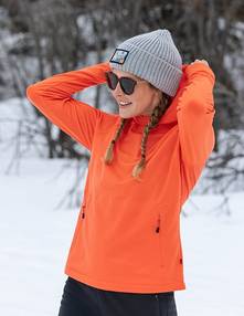 Woman wearing an orange top.