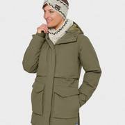 Woman wearing a green winter coat.