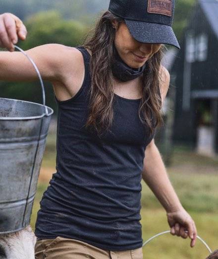 Woman wearing a black tank top.