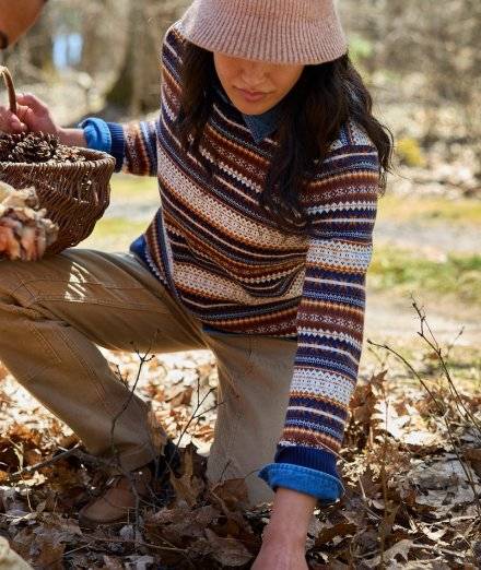 Woman wearing a striped sweater.