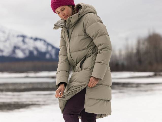 Woman wearing tan winter parka.