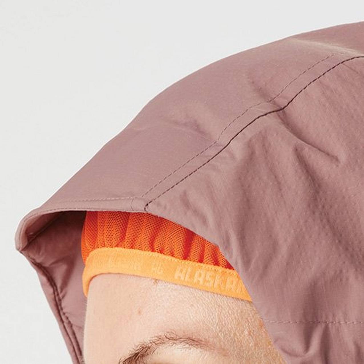 Close up of a hood with an elastic hood liner keeping the hood tight to the head