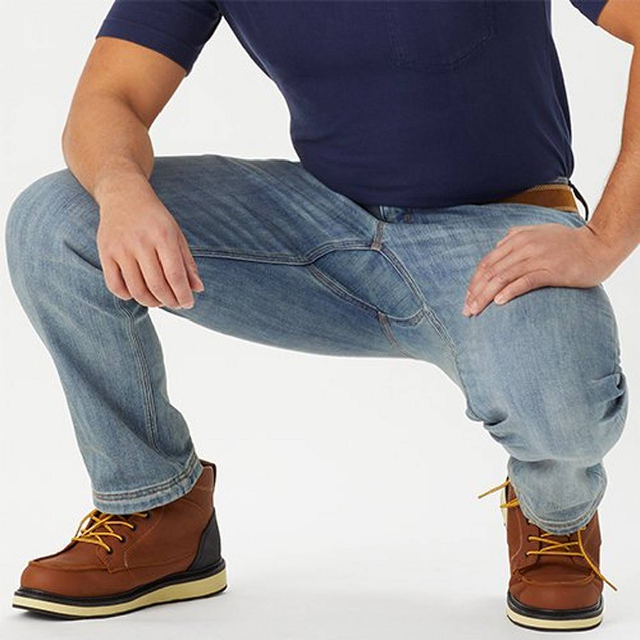 Man crouching in Ballroom Denim