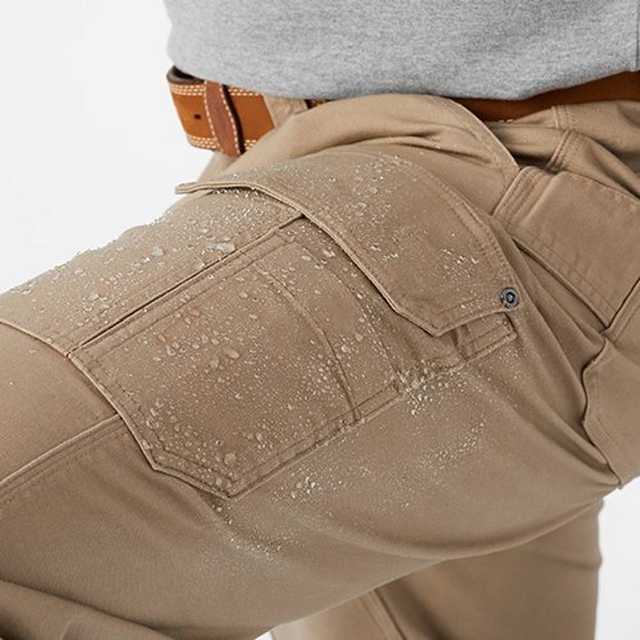 Close up of water beading up on fire hose pants
