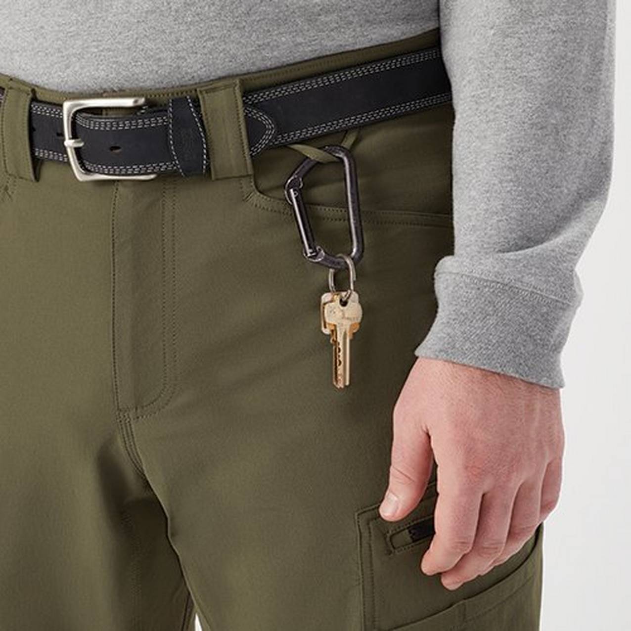 Close up of a pair of pants with a key hanging on a carabiner from a special loop built above the front pocket