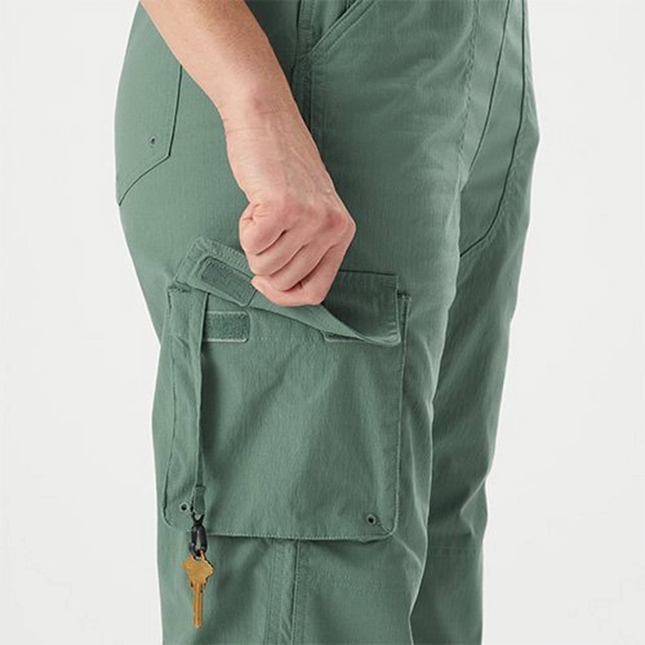 image of person opening cargo pocket on overalls 