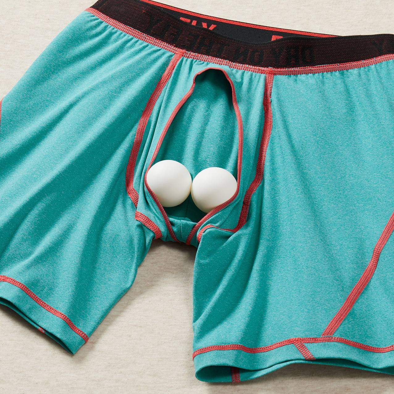 Two ping pong balls cradled in the bullpen pouch of a pair of boxer briefs