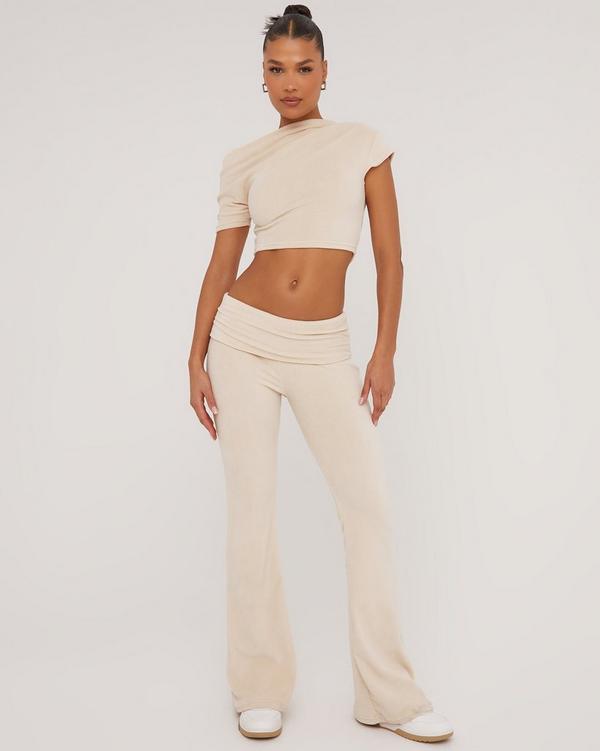 Beige ribbed flared pants and crop top set
