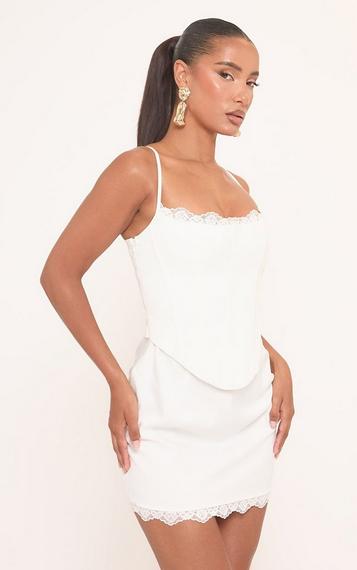 overload mesh bodycon corset mini dress in ivory Misty Mesh Mini Dress the Love Seeker Corset Mini Dress is made in our lightweight Lace Trim Corset Overlay Mini