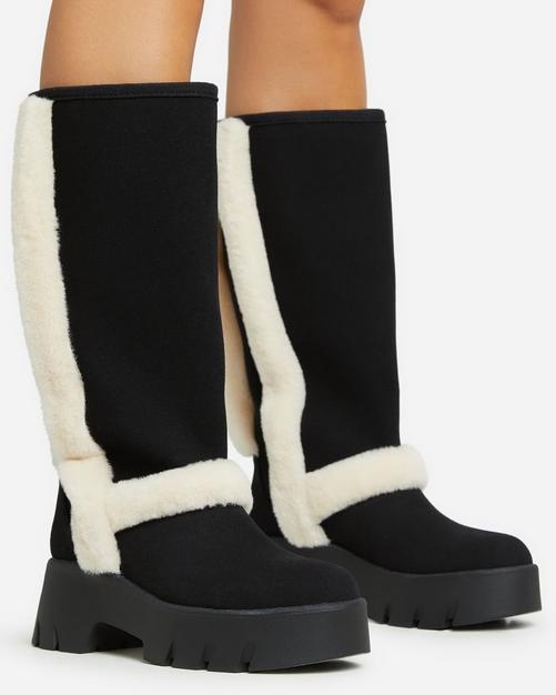 Black boots with white fur outlet trim