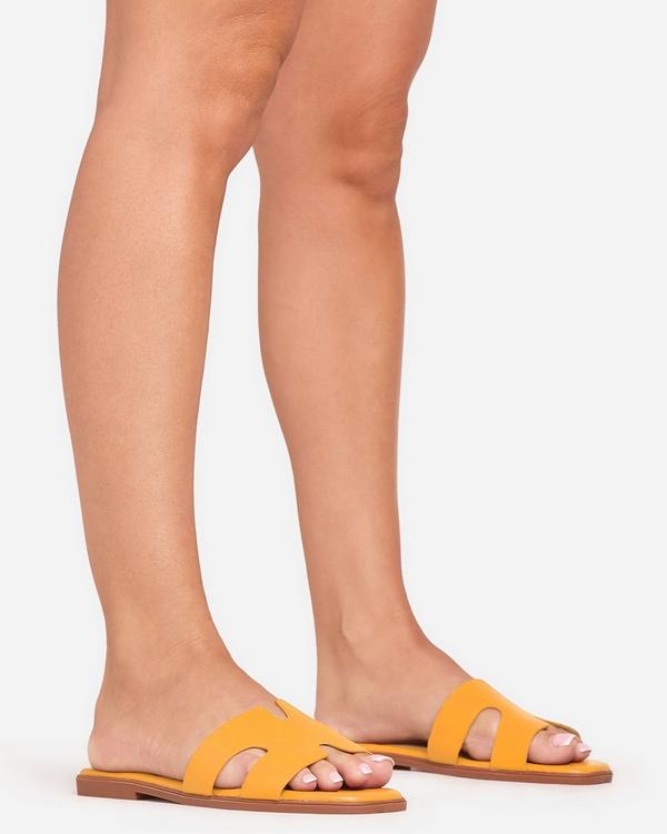 Addison Caged Flat Slider Sandal In Orange Faux Leather